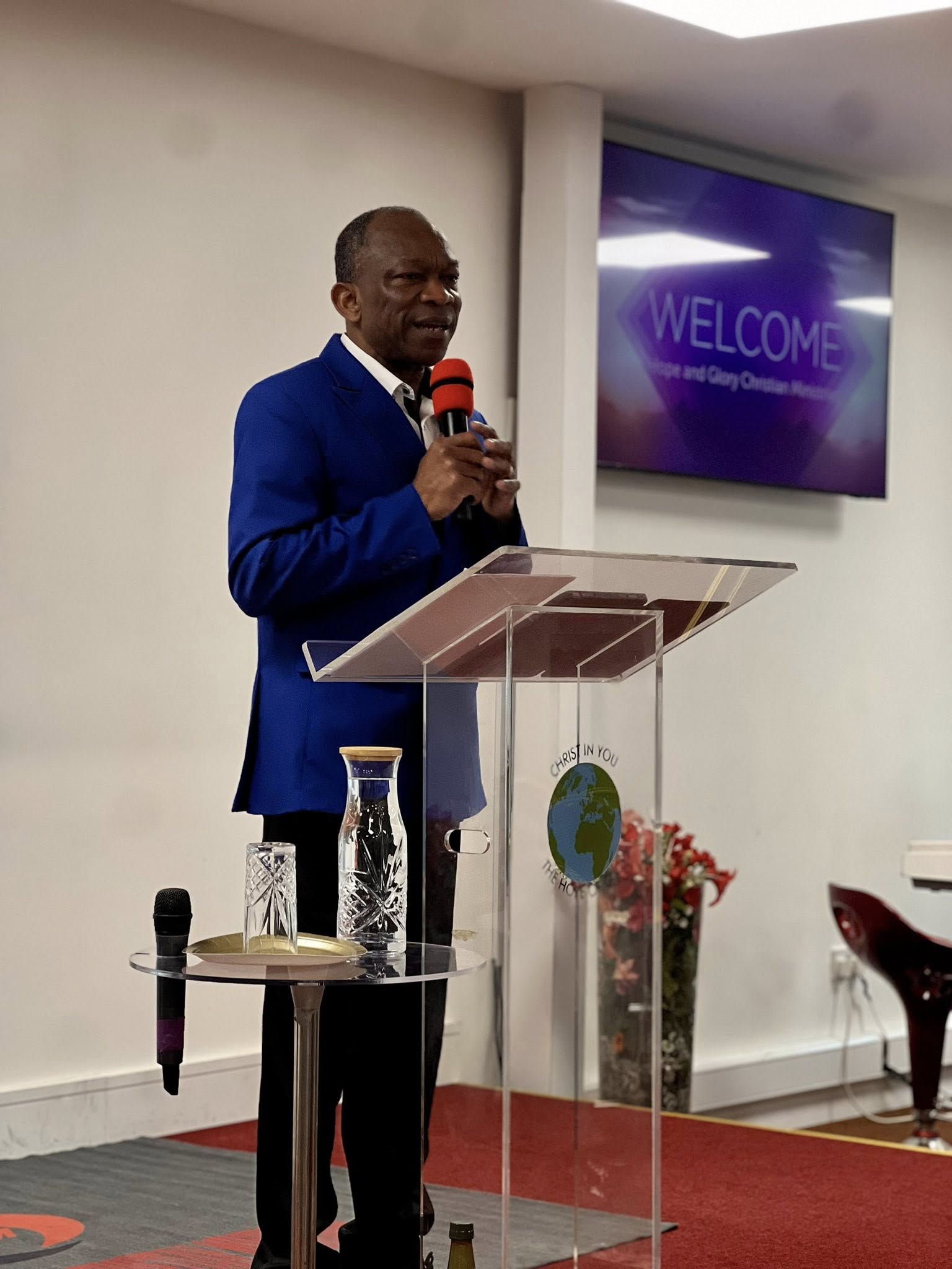 Lead Pastor Anthony Joseph praying and preaching